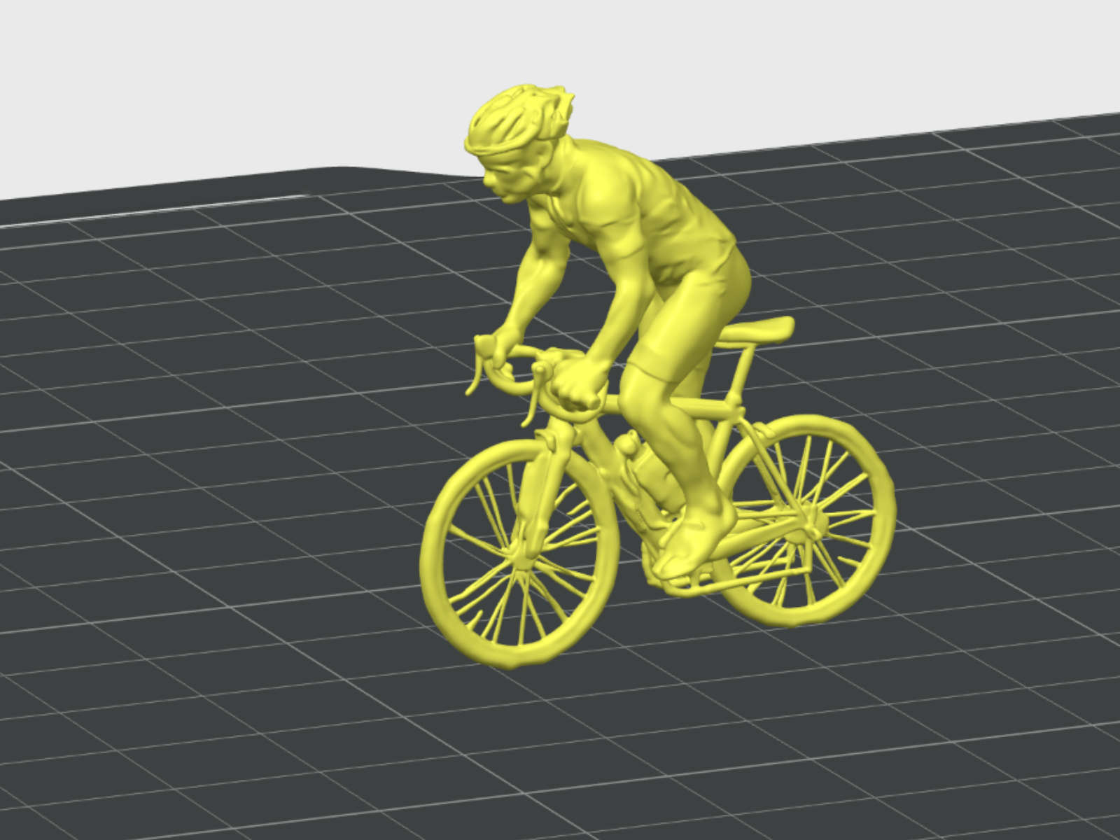 Cyclist standing to climb a hill