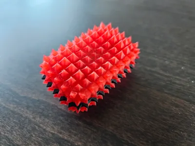 Spikier sensory fidget card with a "thumb groove"