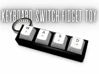 Porte-clés fidget à switchs mécaniques WASD — photo 1