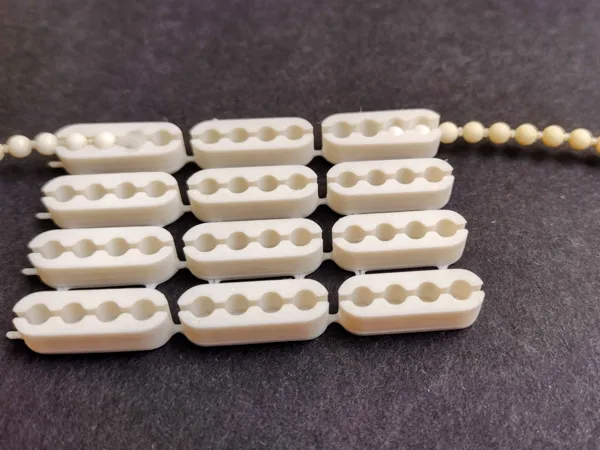 Connecteur de chaînette à billes pour store enrouleur