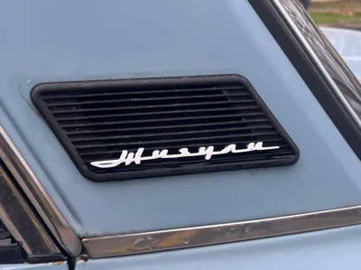 Emblem for the original VAZ-2106 plastic grille