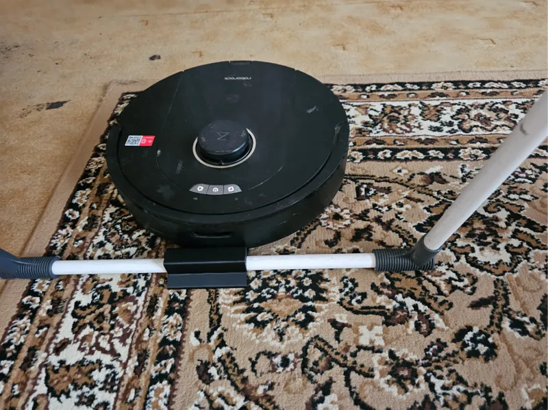 stop  clothes rack against the vacuum cleaner