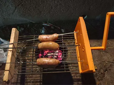 Fiery Swirl Aroma: A Dual-Mode Automatic and Manual Sausage Roaster Designed for Camping