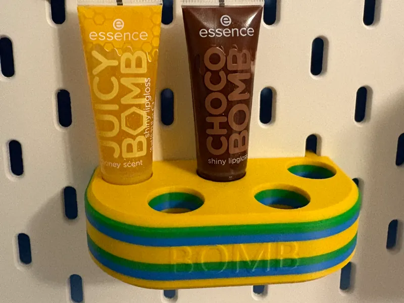 JUICY BOMB lip gloss holder designed for SKÅDIS