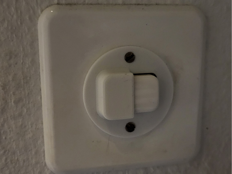 Feller Light Switch Cover (half closed)