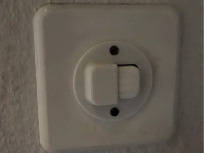 Feller Light Switch Cover (half closed)