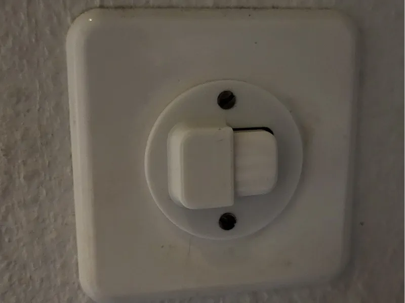 Feller Light Switch Cover (half closed)