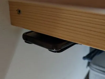 Under desk phone holder - no distraction