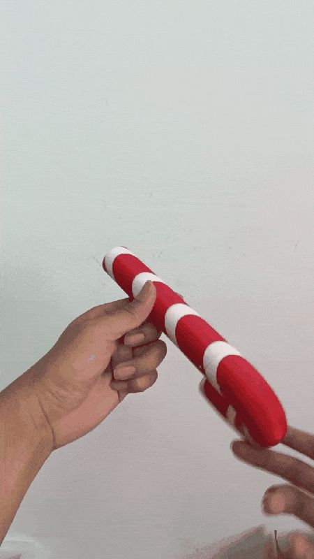 Twist-Extend Candy Cane Saber — Mechanical Toy