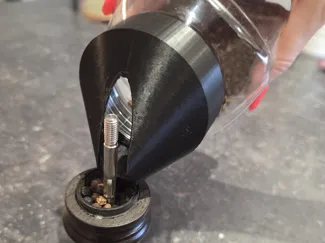 Screw on funnel for refilling peppercorns