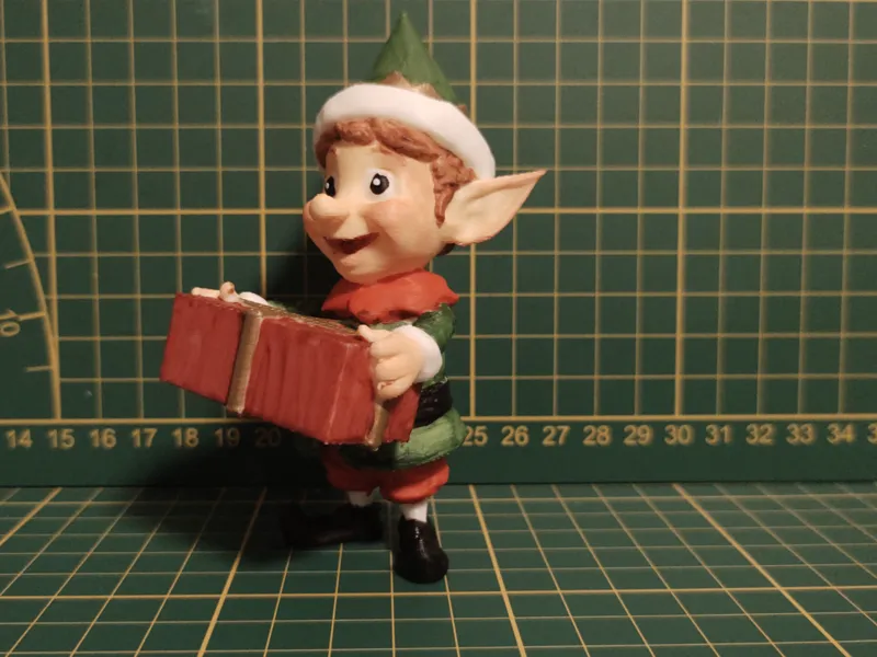Christmas Elf Holding a Present