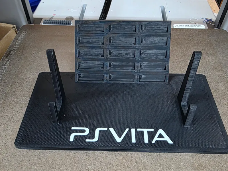 PS Vita 2000 stand console and games