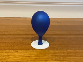 Balloon-powered air hockey set