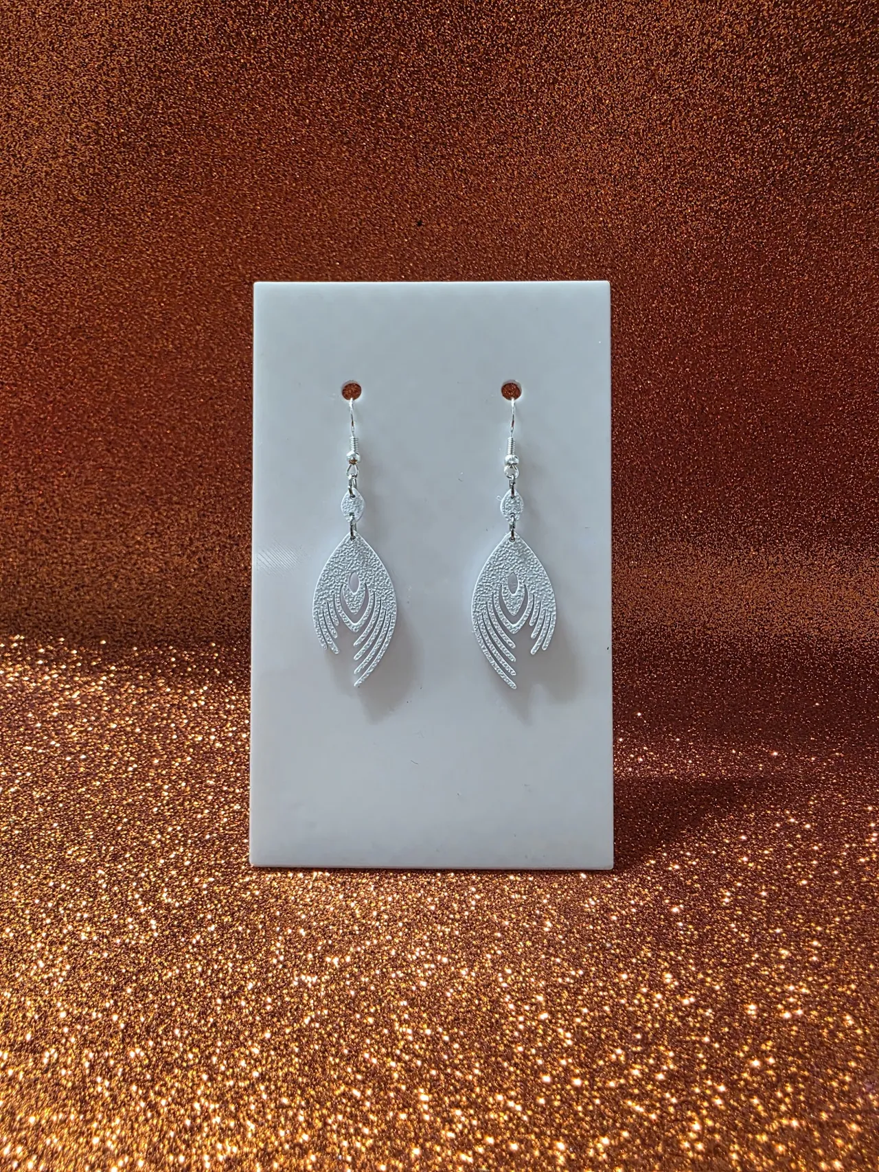 Minimal peacock feather earrings view 2