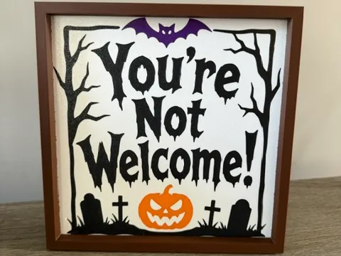 Letrero o emblema decorativo: You're Not Welcome Sign — referencia de MakerWorld