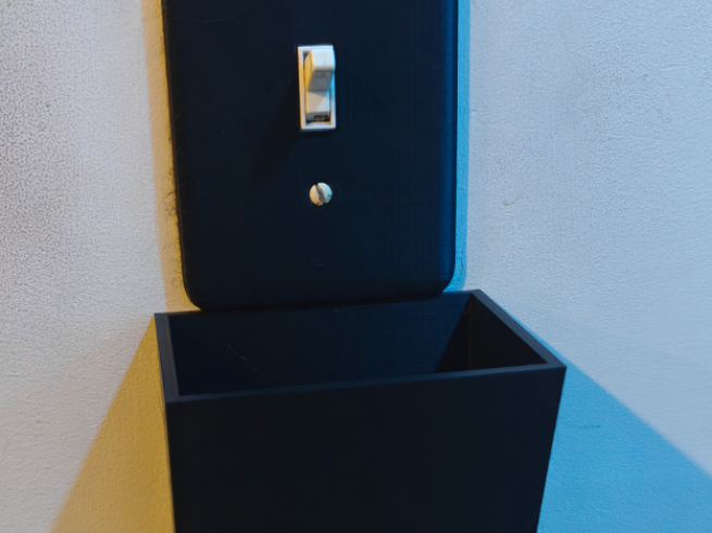 Light switch cover with catch all and key rings