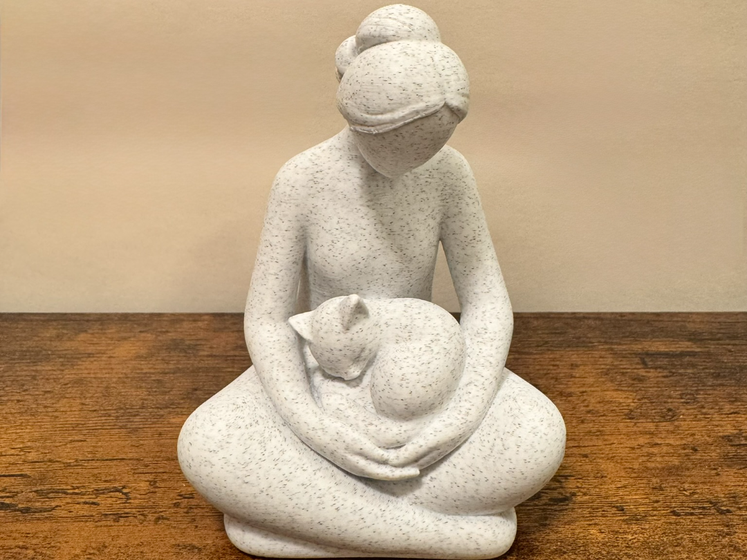 Cozy Companion: Woman with Cat Sculpture
