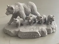 Grizzly Bear 399 and cubs with text.