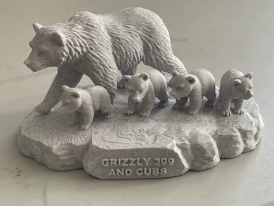 Grizzly Bear 399 and cubs with text.  