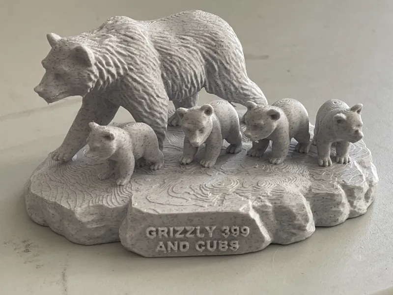 Grizzly Bear 399 and cubs with text.  