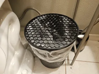 Bathroom trash bin cover to stop canine thieves