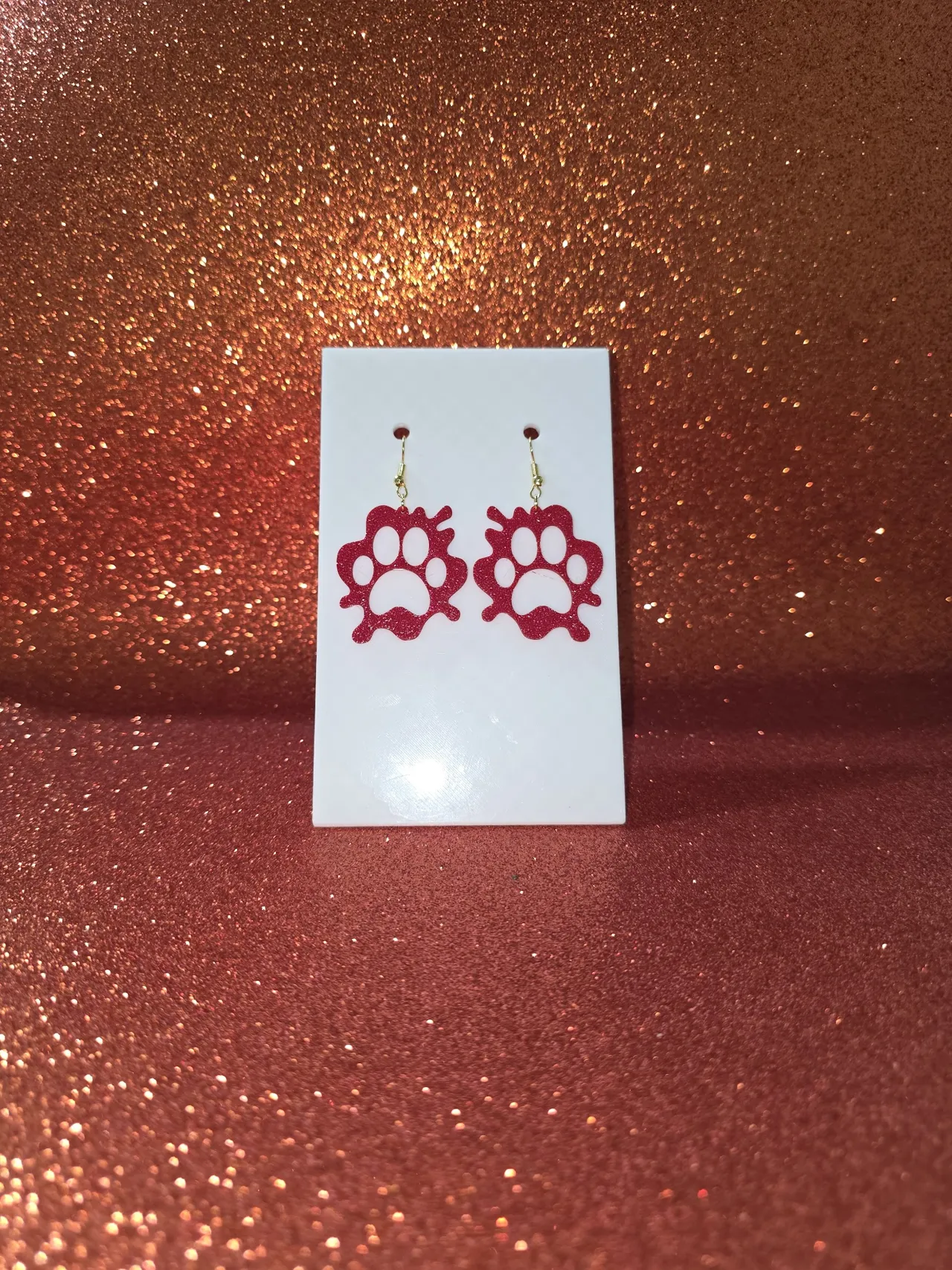 Painted paw puddle earrings view 2