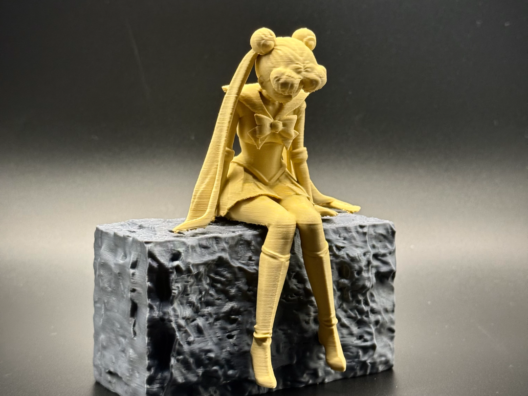 Sad Sailor Moon Anime Figurine sitting on a ledge!