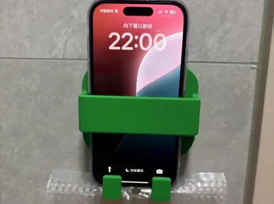 Wall-mounted phone holder