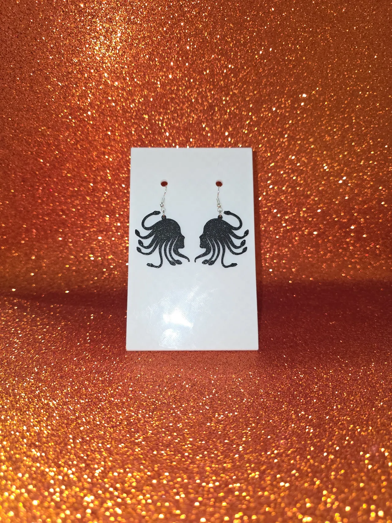 Minimal Medusa earrings view 2