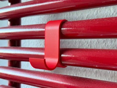 Hooks for a heated towel rail