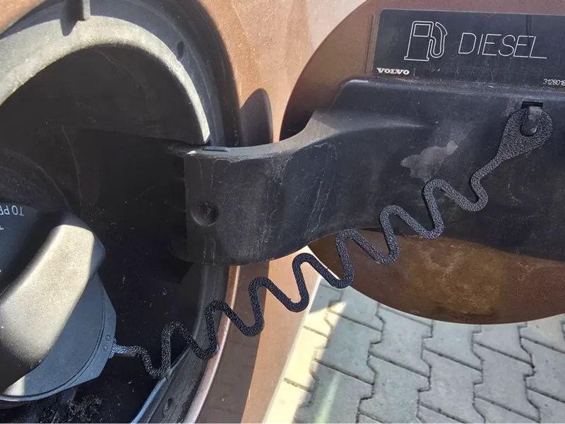 Volvo "XC60" fuel cap retaining strap.