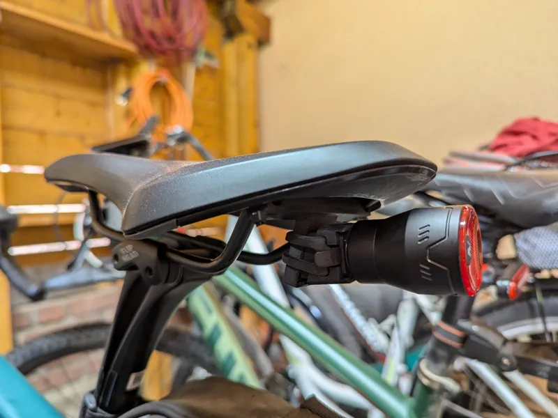 Bicycle taillight holder on the saddle