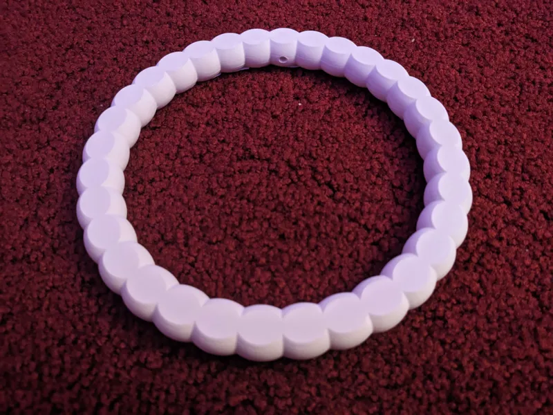 Hoopy Bird: 4 - Pearl strand - circular swing toy