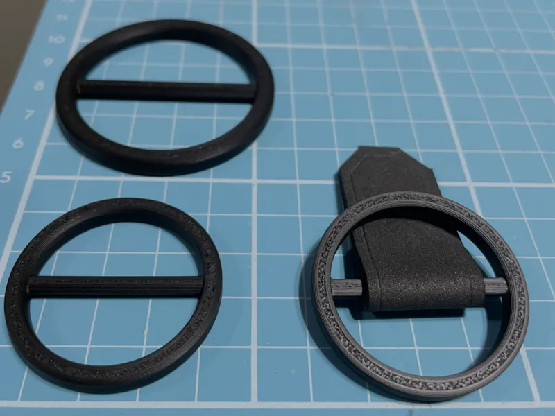 Round strap adjuster buckles