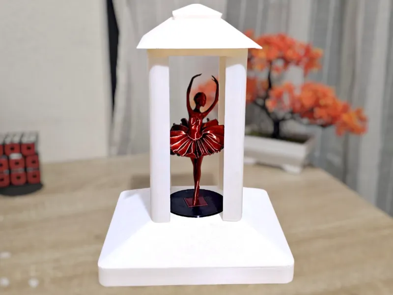Rotating kiosk-style base with classical ballerina