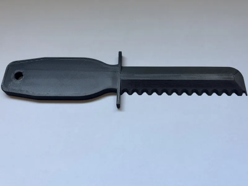 Mower Deck Scraper with Serrated Edge