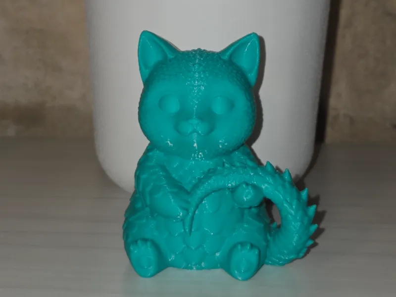 Cute cat with scales and a dragon's tail