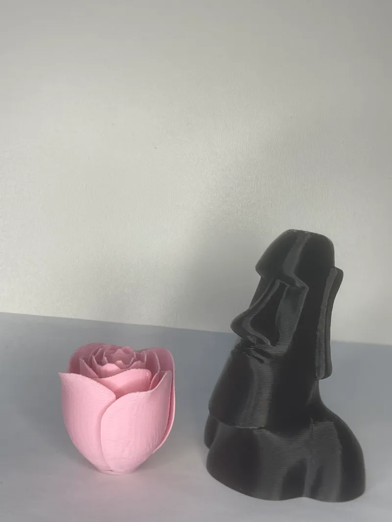moai stone statue and a rose