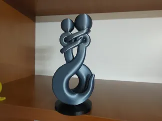 scultura ABBRACCIO metallo