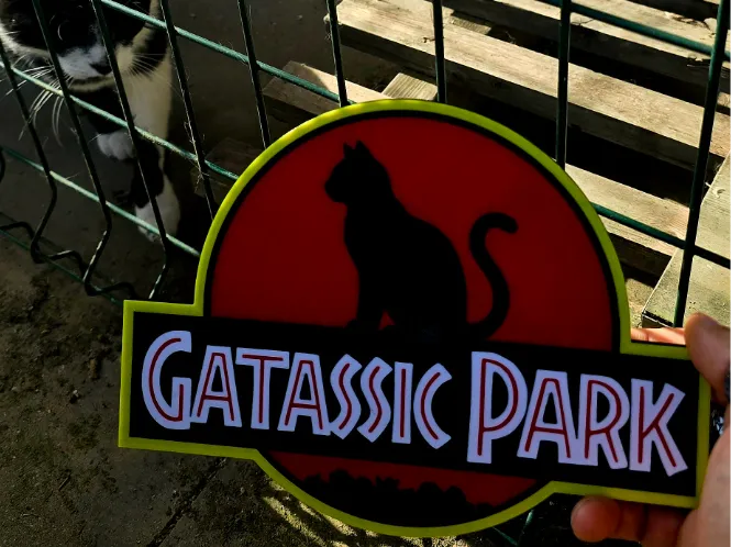 Gatassic Park Cartel parodia gato