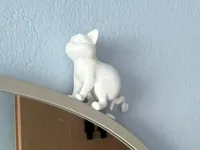Figurine chat qui fait caca — photo 1