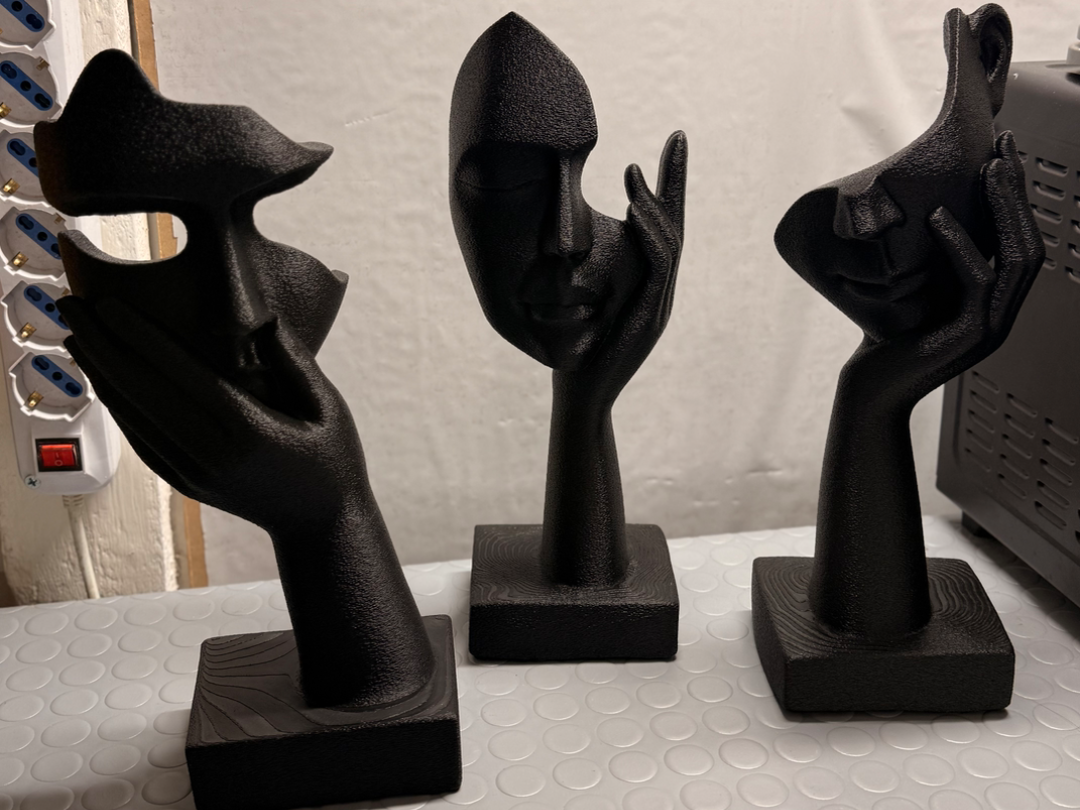 Faces Sculpture