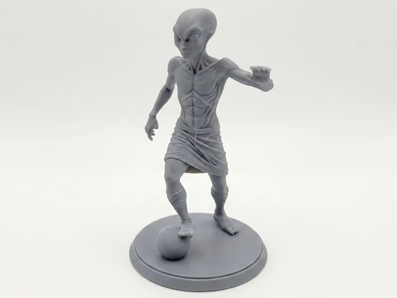 Grey Alien Playing Soccer