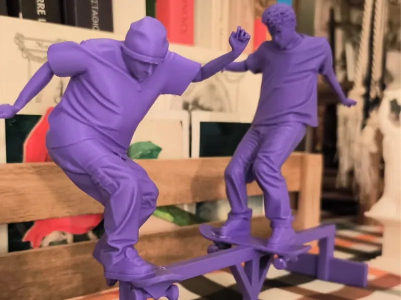 skaters on a rail