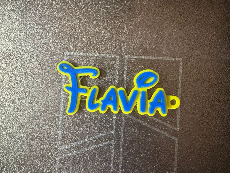 llavero nombre flavia en letras disney