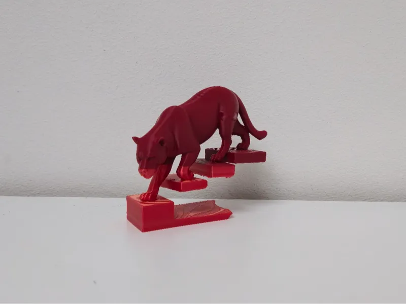 Red Cougar on Floating Stairs Statue
