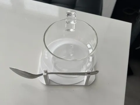 Coaster with spoon holder