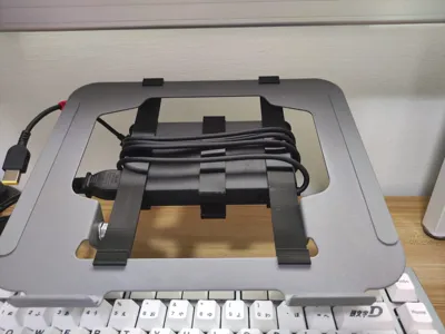 Laptop stand charging brick holder