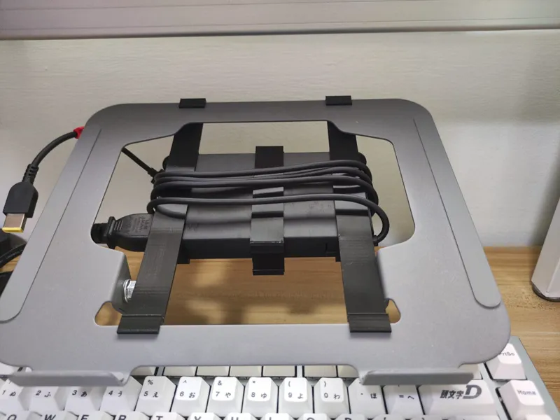 Laptop stand charging brick holder