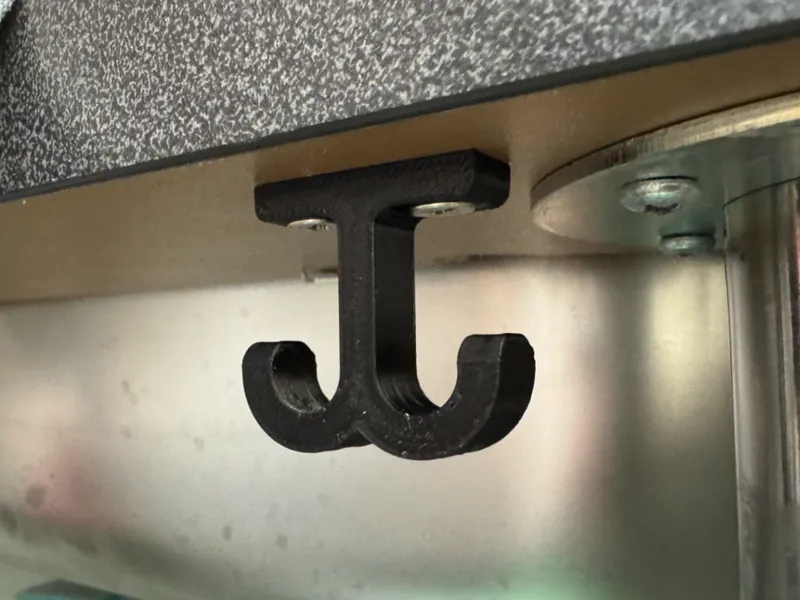 Top mounted towel hanger